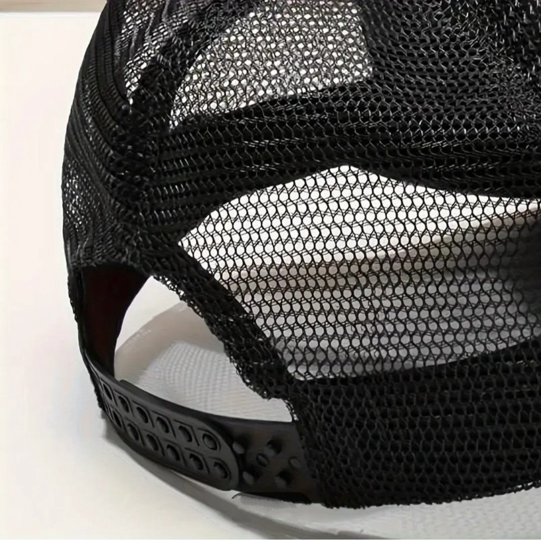 Close-up of the back mesh and adjustable strap of a premium black trucker hat by LUXUSIO